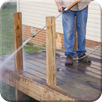 Man Pressure-washing the Deck