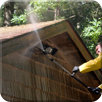 Man Pressure-washing the Roof