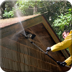 Man Pressure-washing the Roof